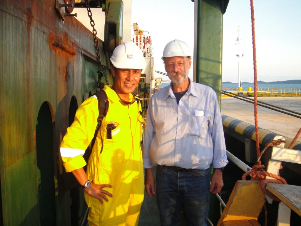 Company representative on board a vessel with a client