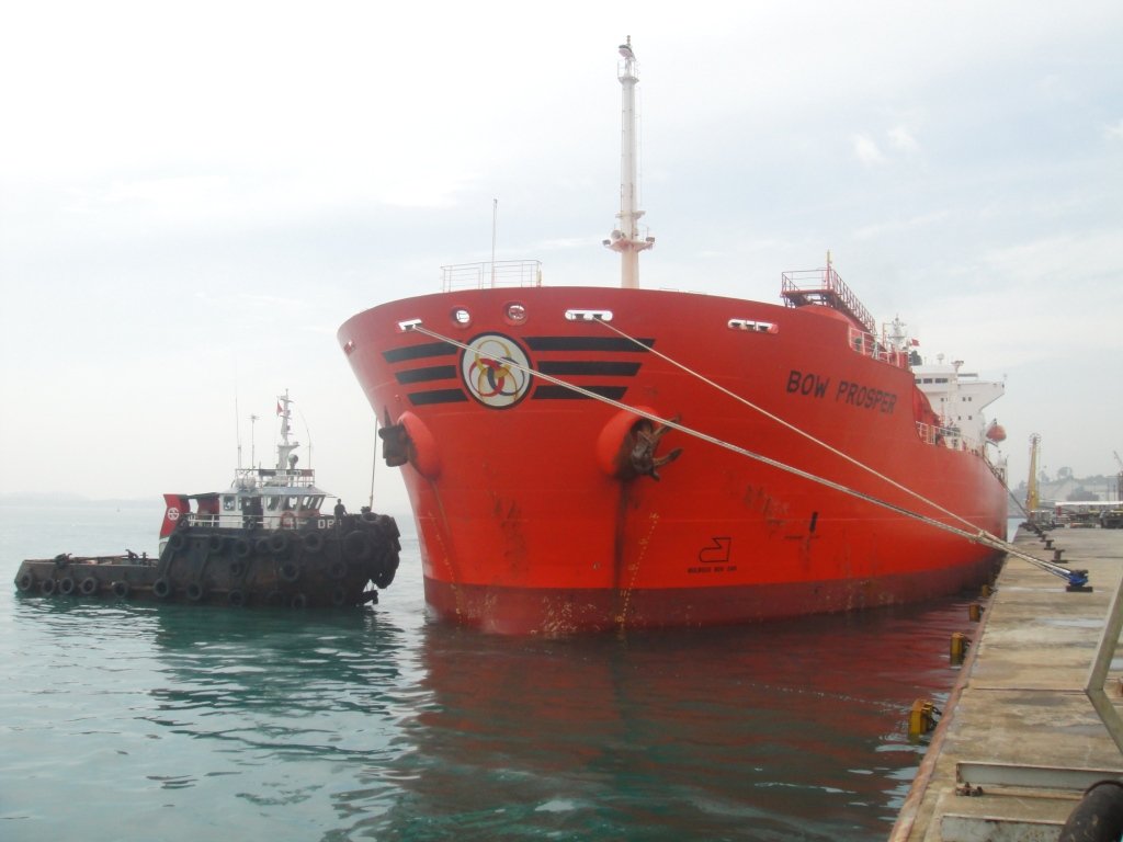 Tanker Bow Prosper at berth with tugboat